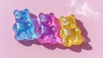 Three gummy bears on a pink background photo