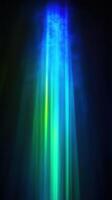 Ethereal blue and green light beams radiating through dark space creating a mystical and serene atmosphere with glowing abstract patterns photo