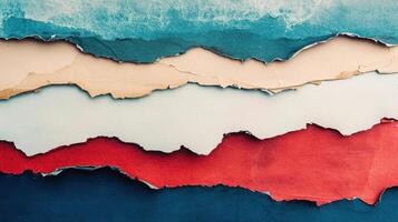 Colorful layers of torn paper in abstract design featuring blue, cream, and red hues with textured visual appeal and dramatic contrast photo