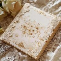 Elegant decorative wedding invitation card with intricate floral design and lace accents, resting on a soft lace background, perfect for special occasions and celebrations photo