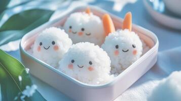 Rice with carrots and bunny faces in a pink container photo