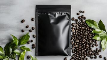 Black coffee bag with green leaves on a gray background photo