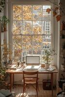 Autumnal Workspace Near Window And Computer photo