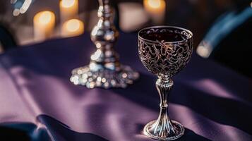 gothic-inspired dining table with a deep purple tablecloth photo