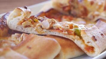 Delicious stuffed crust pizza being served at a restaurant video