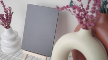 Decorative vases and art display in modern interior setup video