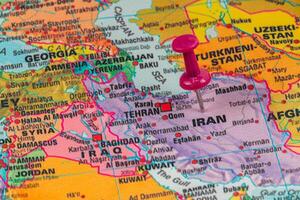 Location pin marks Tehran on a colorful map of Iran photo