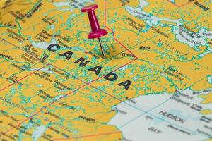 Map of Canada with a pushpin marking a specific location photo