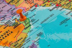 Pinpointing Oman on a vibrant world map in detail photo