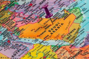 Exploring the map of Saudi Arabia with a pushpin marker photo