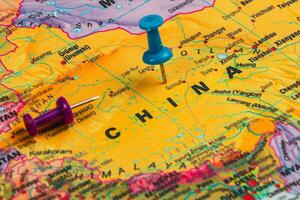 Colorful map of China marked with push pins for travel plans photo
