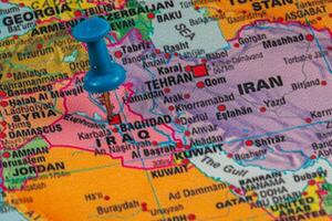 Map highlighting Iraq with pushpin indicating location photo