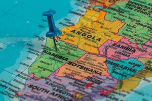 Pinpointing a location on a colorful map of Southern Africa photo