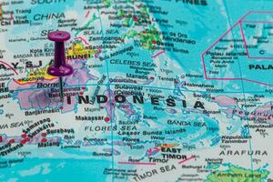 Map highlighting Indonesia with pushpin marker near Borneo photo