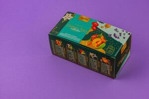 Lviv Ukraine 05.06.25 Colorful box of green tea displayed on pink background photo