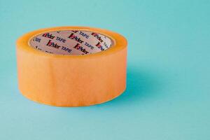 Lviv Ukraine 05.06.25 Yellow masking tape on a pink background with clear design photo