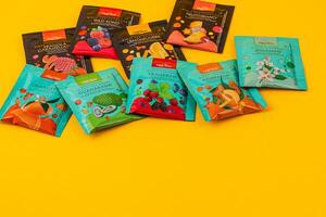 Lviv Ukraine 05.06.25 Fruit-flavored candy on a yellow background photo