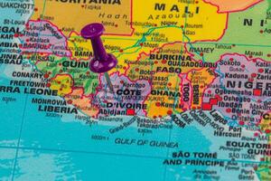 Pin marks location on a map of West Africa in colorful detail photo