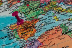 Map highlighting Spain with a pushpin in Europe photo