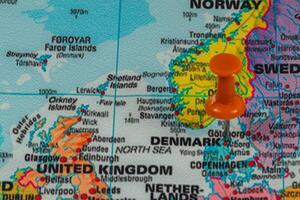 Map highlighting Denmark with an orange pushpin near Sweden photo