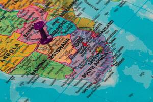 Location pin marks Botswana on a colorful map of Africa photo