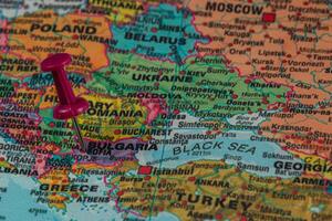 Map highlighting Bulgaria and Romania with a pushpin inserted photo