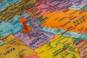Exploring Egypt on a colorful map with a pushpin photo