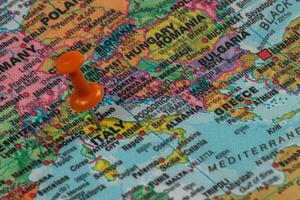Map showing Italy with a pin to indicate location details photo