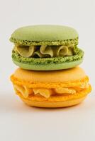 Colorful macarons stacked on a clean white background photo