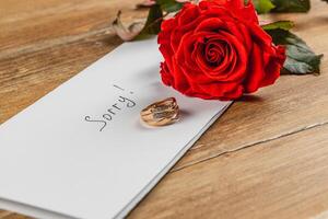 Engagement ring and rose convey heartache from broken engagement photo