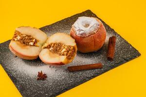 Delicious baked apples with cinnamon and nut filling photo