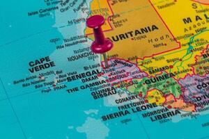 Pinpointing Dakar on a colorful map of West Africa photo