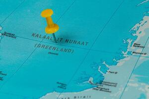 Pin marking Kalaalit Nunaat region on a map of Greenland photo