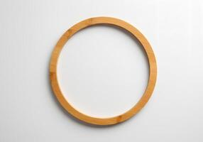 A wooden circle on a white surface photo