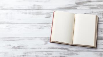 open book or magazine lying on a white wooden surface. The book appears to be blank photo