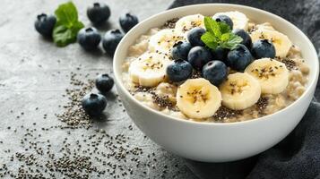 Wholesome Breakfast Bowl of Oatmeal Topped with Fresh Fruits and Nuts for a Nutritious Start to Your Day photo