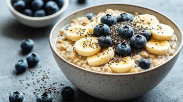 Nutritious Breakfast Bowl of Oatmeal Topped with Fresh Fruits and Nuts for a Healthy Start photo