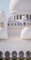 Abu Dhabi, United Arab Emirates, 2025 - Close-up of the white dome at the top of the mosque in Abu Dhabi, UAE photo