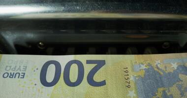 Euro banknotes during counting in the counting machine. The currency of the European Union. photo