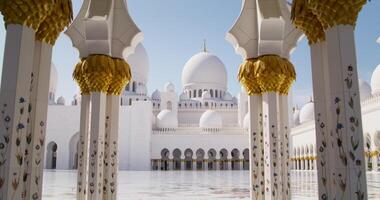 The courtyard of a mosque in Abu Dhabi, UAE. View through the columns photo