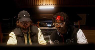 Listening to the song after recording in the studio. photo