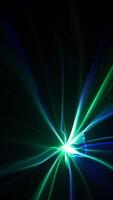 Vibrant beams of light in shades of blue and purple converge towards a central bright spot, creating a dynamic and energetic abstract composition video