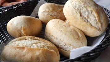 Freshly baked bread rolls served warm at local bakery video