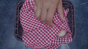 Bread and checkered cloth basket in outdoor setting video