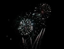 Stunning fireworks display exploding against a dark night sky. photo