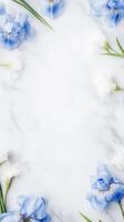 Delicate blue and white irises frame a pristine white marble surface, offering a tranquil and sophisticated ambiance perfect for design projects photo