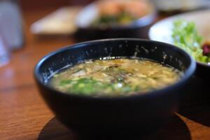 egg soup Chinese cabbage with chopped pork soup on bamboo tray photo