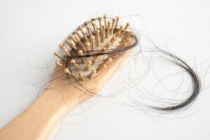 Hair loss fall with comb bush serious problem health photo