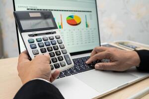 accountant working and analyzing financial reports project photo