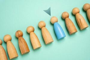 Select a person from a sample group. Suitable candidate. Hiring. Recruiting for service. Promotion at work. Career development. Finding the most suitable individual for the role or service. photo